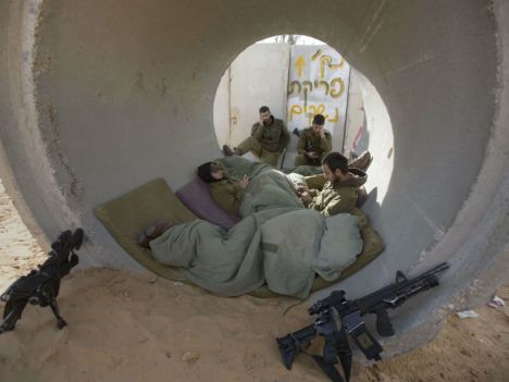 Israeli soldiers inside  a as shelter for rockets